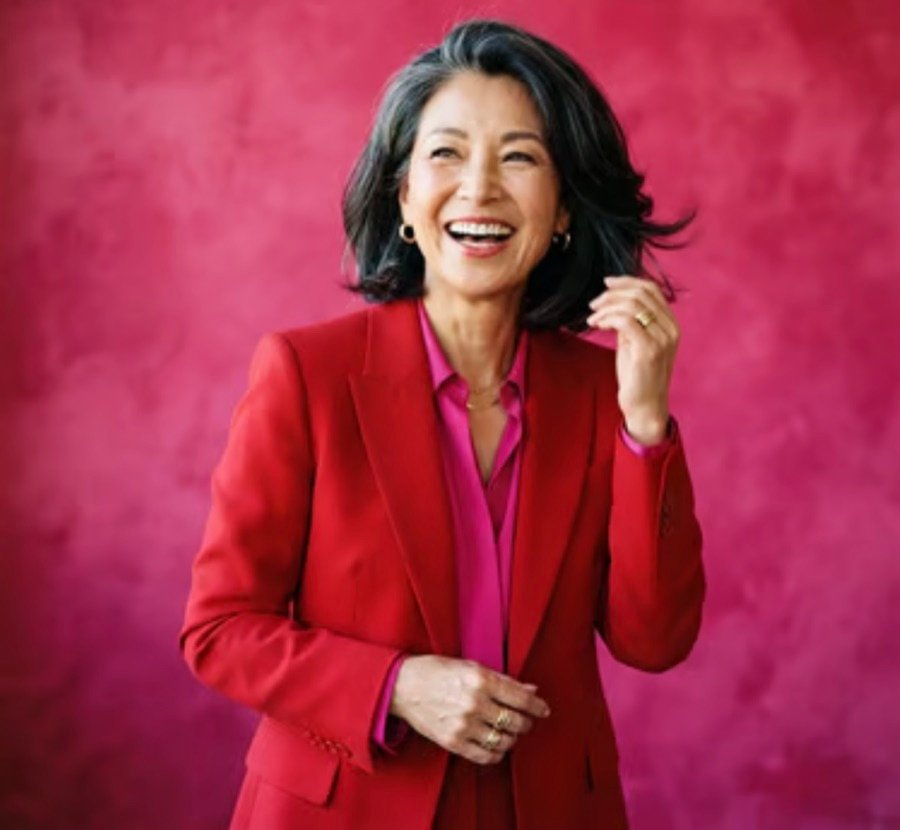 A woman over fifty at work, mid-conversation
